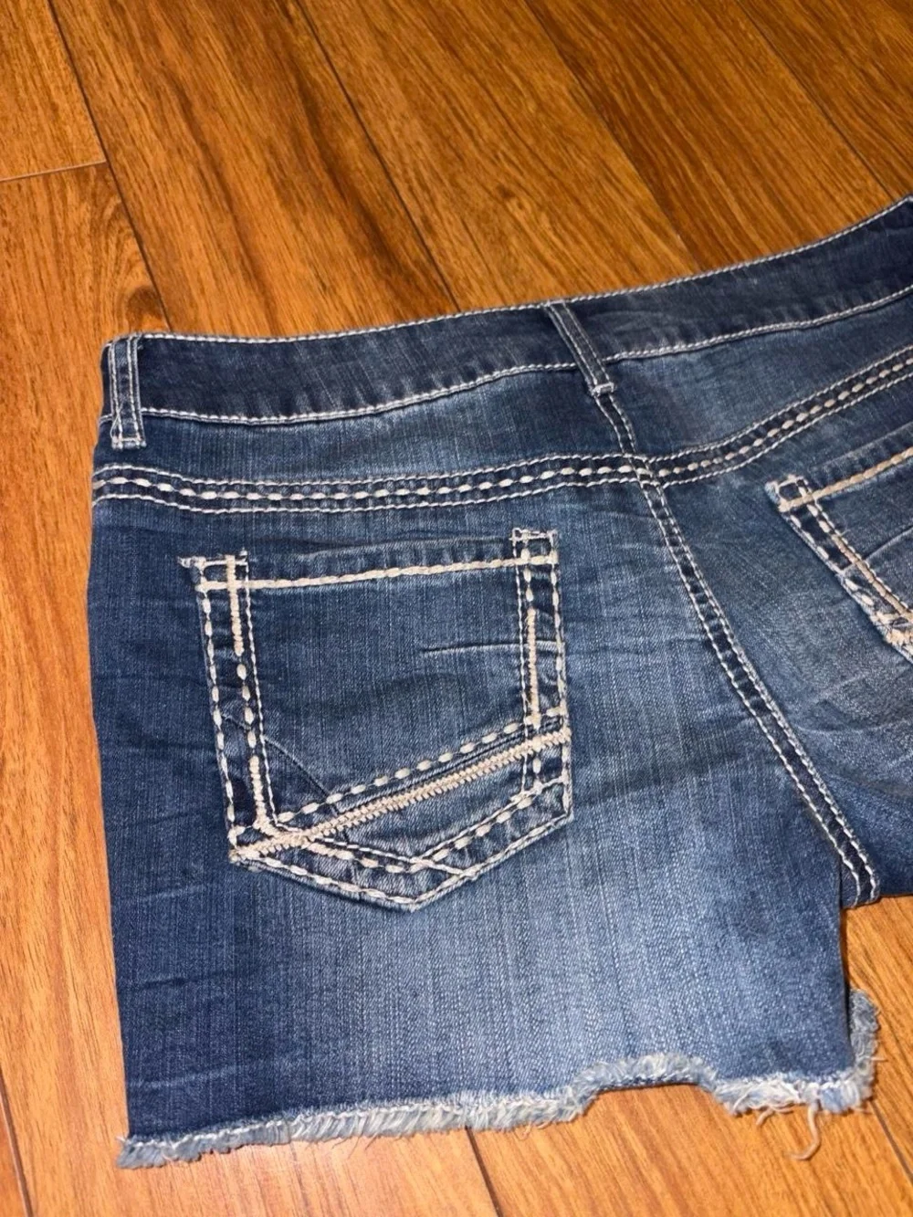 blue denim Y2K shorts with white stitching